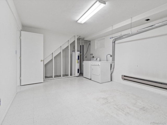 basement with light floors, washing machine and dryer, water heater, and a baseboard heating unit