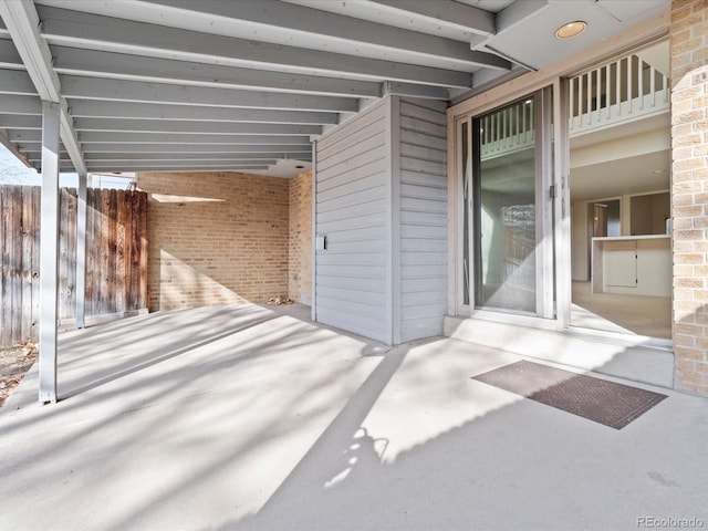 view of patio / terrace featuring fence