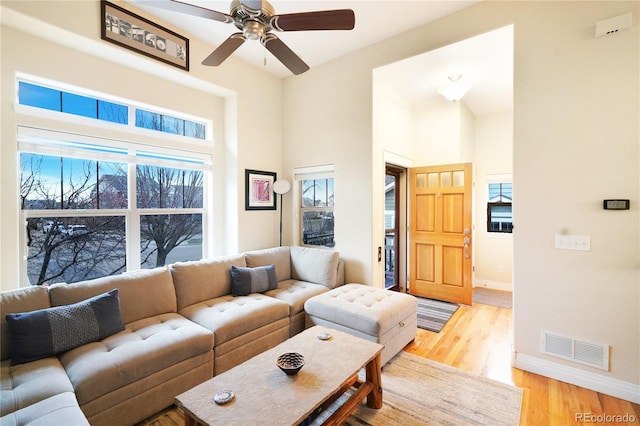 1544 Cottonwood Ave, Lafayette, CO 80026 - living room featuring light wood-style flooring, plenty of natural light, baseboards, and visible vents