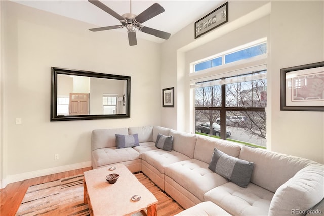 1544 Cottonwood Ave, Lafayette, CO 80026 - living room featuring light wood-style flooring, a ceiling fan, and baseboards