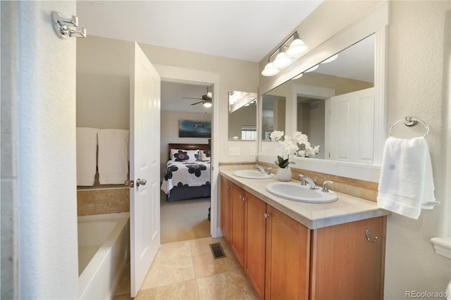 1544 Cottonwood Ave, Lafayette, CO 80026 - ensuite bathroom featuring ceiling fan, connected bathroom, visible vents, and a sink