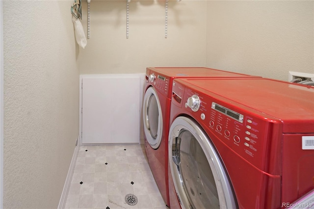 1544 Cottonwood Ave, Lafayette, CO 80026 - laundry room featuring a textured wall, laundry area, and washing machine and clothes dryer