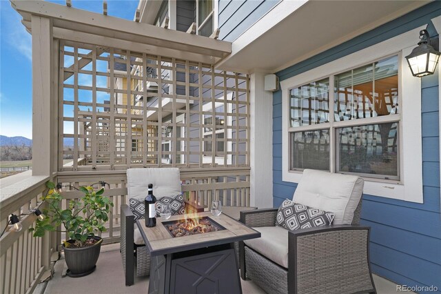 1544 Cottonwood Ave, Lafayette, CO 80026 - view of patio / terrace featuring a mountain view and an outdoor fire pit