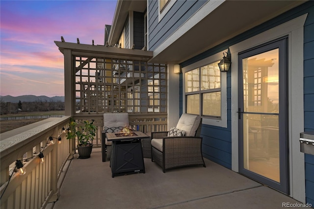 1544 Cottonwood Ave, Lafayette, CO 80026 - patio terrace at dusk featuring a mountain view and a fire pit