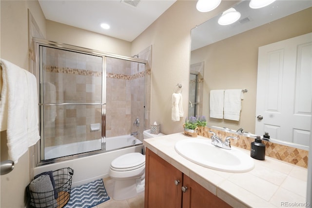 1544 Cottonwood Ave, Lafayette, CO 80026 - full bath with tile patterned flooring, visible vents, toilet, combined bath / shower with glass door, and vanity