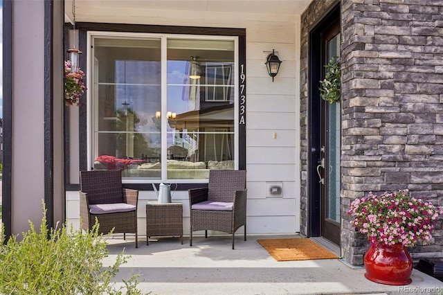 19733 W 93rd Ln Unit A, Arvada, CO 80007 - property entrance featuring covered porch