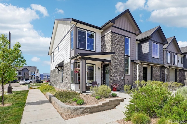 19733 W 93rd Ln Unit A, Arvada, CO 80007 - view of front of house featuring stone siding and a porch