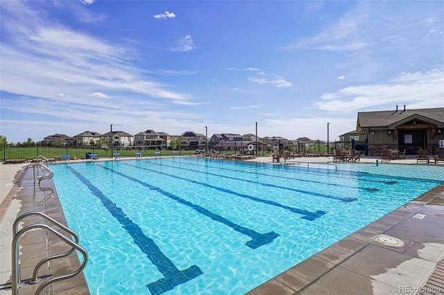 19733 W 93rd Ln Unit A, Arvada, CO 80007 - community pool with a residential view and a patio area