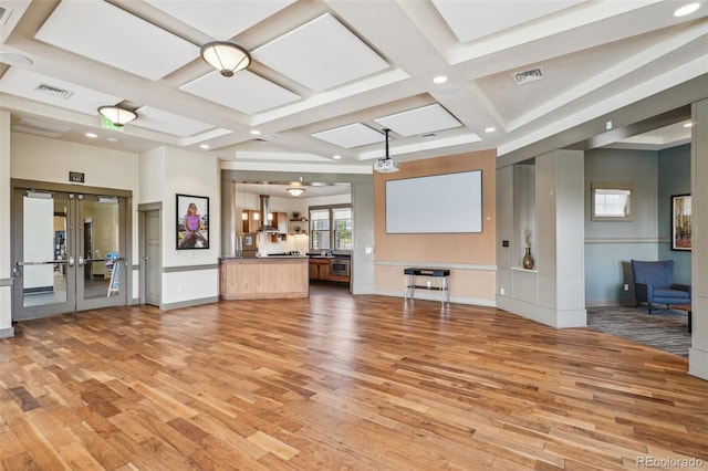 19733 W 93rd Ln Unit A, Arvada, CO 80007 - unfurnished living room with coffered ceiling, light wood-type flooring, french doors, recessed lighting, and baseboards