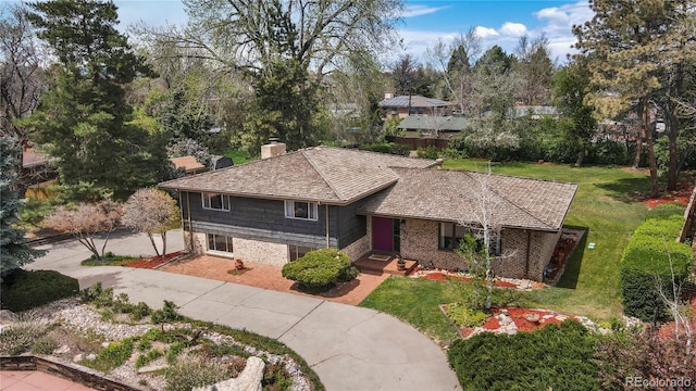 5503 W Colorado Ave, Lakewood, CO 80232 - view of front of property featuring a chimney and a front lawn