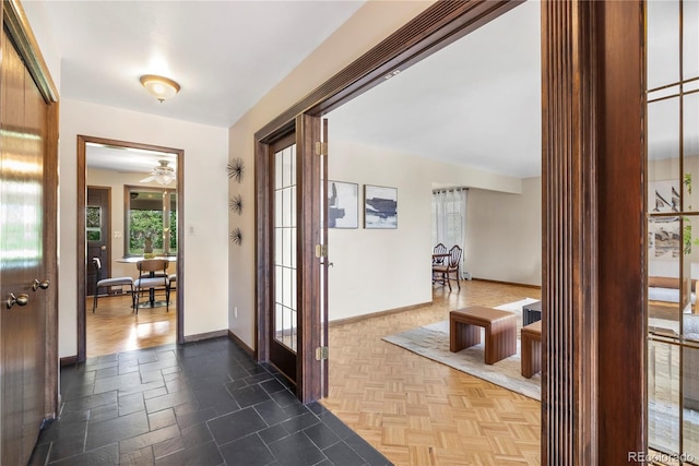 5503 W Colorado Ave, Lakewood, CO 80232 - doorway to outside with baseboards and a ceiling fan