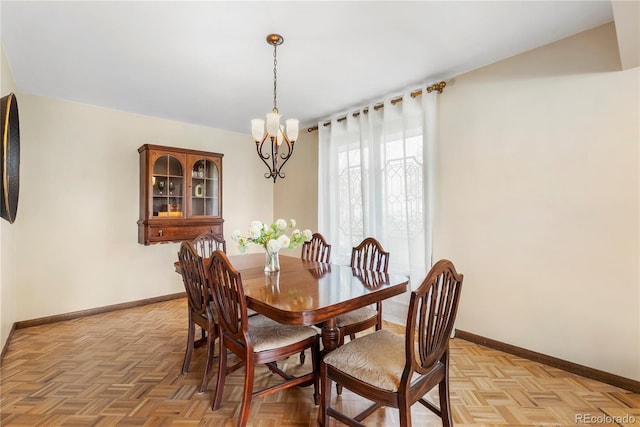 5503 W Colorado Ave, Lakewood, CO 80232 - dining room featuring baseboards and a notable chandelier