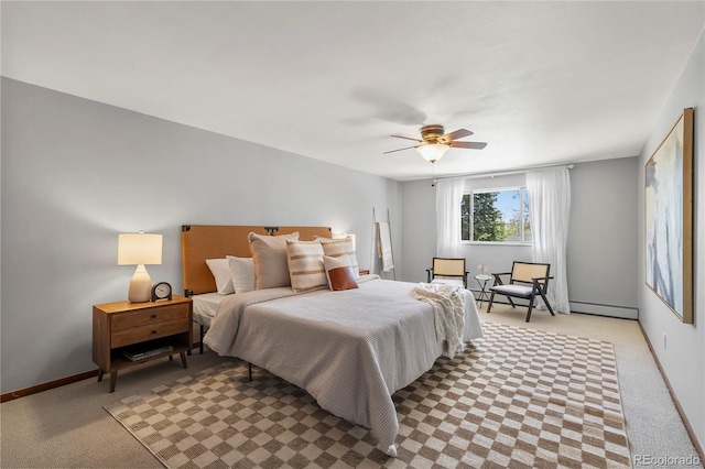 5503 W Colorado Ave, Lakewood, CO 80232 - bedroom featuring light colored carpet, baseboards, ceiling fan, and a baseboard heating unit