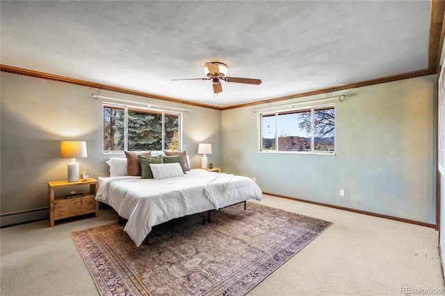 5503 W Colorado Ave, Lakewood, CO 80232 - carpeted bedroom with crown molding, baseboards, ceiling fan, and a baseboard heating unit