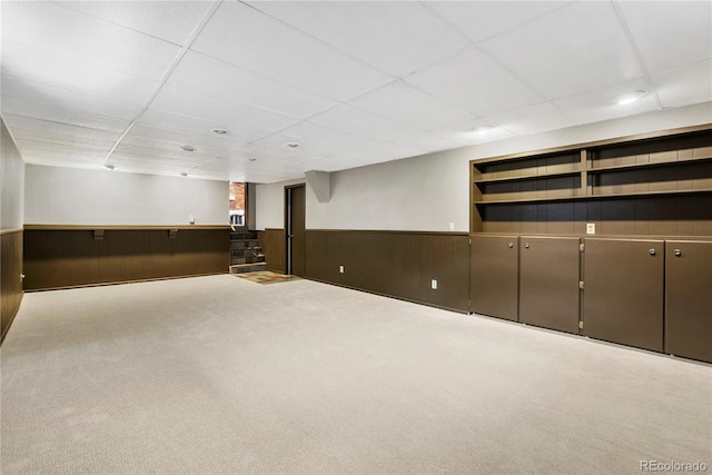 5503 W Colorado Ave, Lakewood, CO 80232 - finished basement with wooden walls, a drop ceiling, wainscoting, and carpet