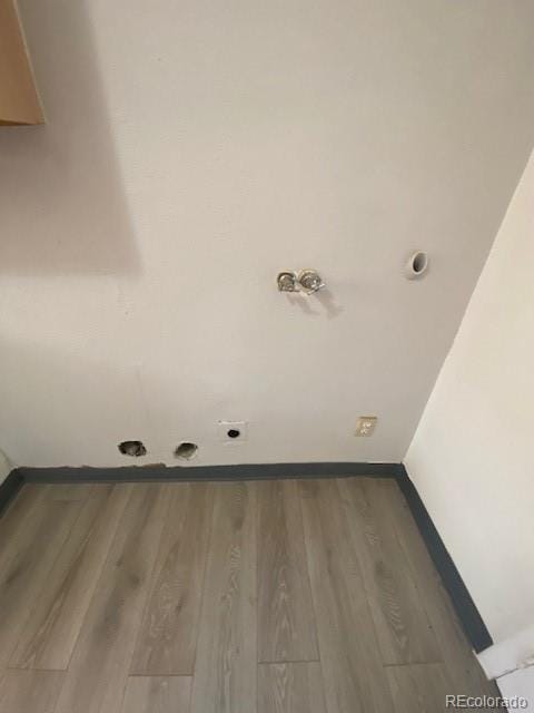 laundry room featuring wood-type flooring