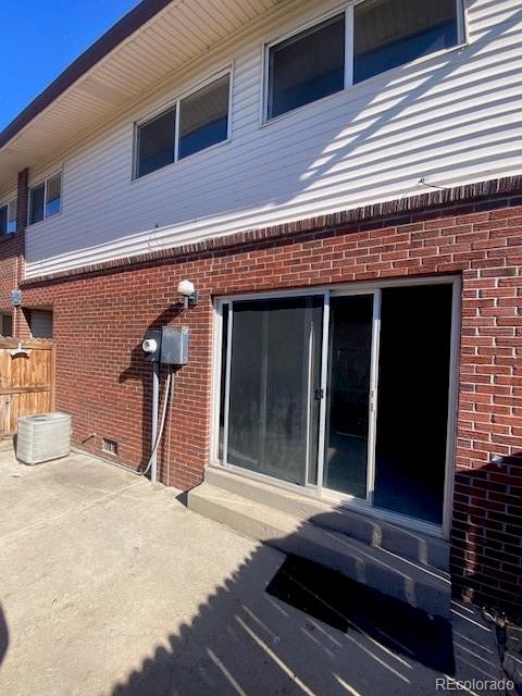 back of house with a patio