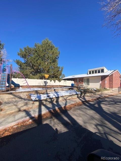 view of front of house with a playground