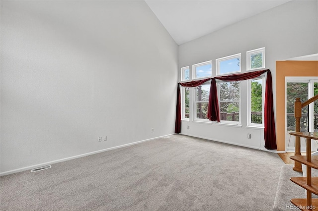 4386 W Deertrail Ct, Castle Rock, CO 80109 - carpeted empty room with high vaulted ceiling and baseboards