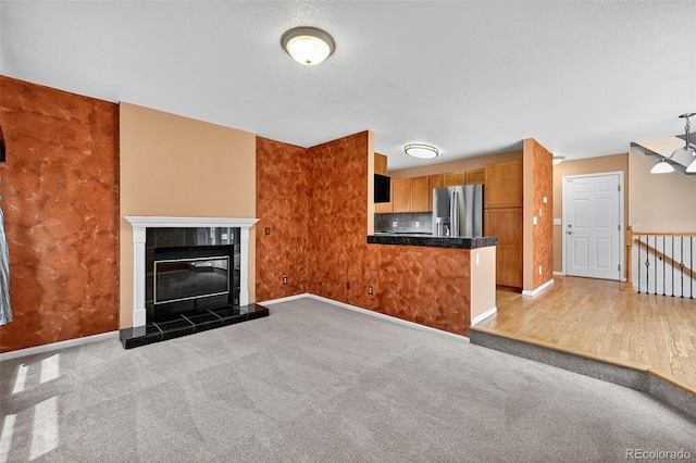 4386 W Deertrail Ct, Castle Rock, CO 80109 - unfurnished living room with carpet and a fireplace