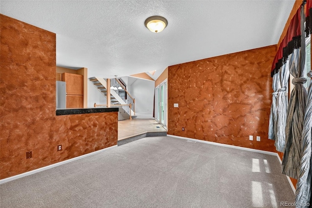 4386 W Deertrail Ct, Castle Rock, CO 80109 - unfurnished room with a textured ceiling, stairway, and carpet