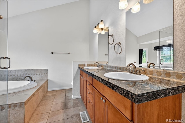 4386 W Deertrail Ct, Castle Rock, CO 80109 - bathroom with double vanity, a garden tub, lofted ceiling, tile patterned flooring, and an enclosed shower