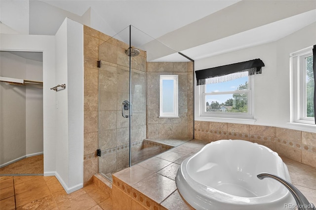 4386 W Deertrail Ct, Castle Rock, CO 80109 - full bath with tiled shower, a bath, and a spacious closet