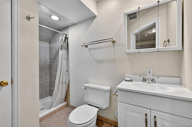 4386 W Deertrail Ct, Castle Rock, CO 80109 - full bath featuring vanity, a stall shower, tile patterned flooring, and a textured wall