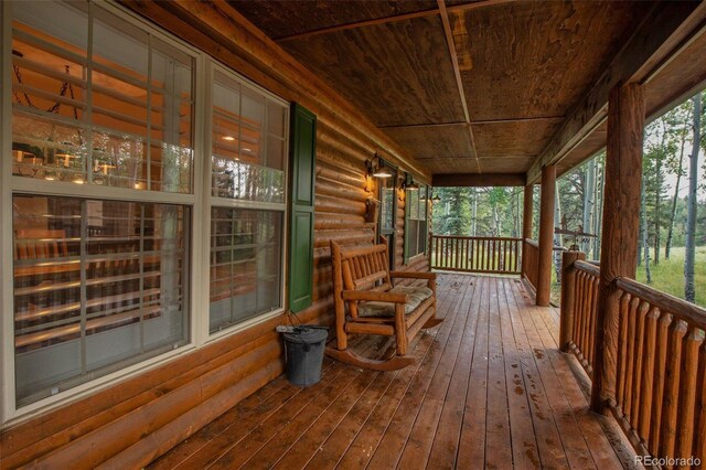 wooden deck featuring covered porch