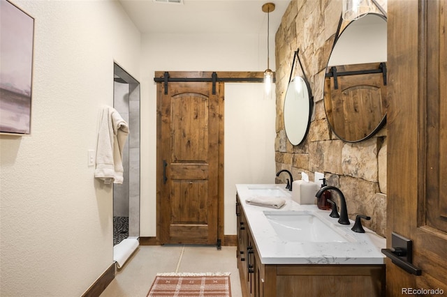 full bath with double vanity, visible vents, and a sink