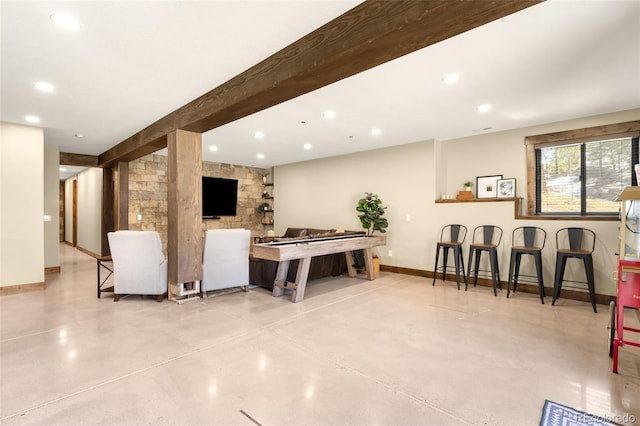 recreation room featuring beamed ceiling, recessed lighting, baseboards, and finished concrete floors