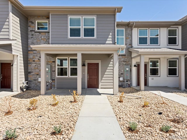 1618 Riverplace Dr Unit 2, Windsor, CO 80550 - view of front facade featuring stone siding