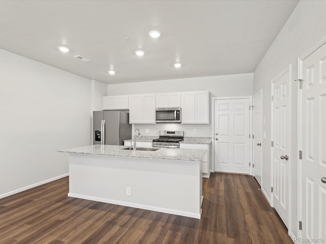1618 Riverplace Dr Unit 2, Windsor, CO 80550 - kitchen with appliances with stainless steel finishes, a sink, dark wood finished floors, a center island with sink, and recessed lighting