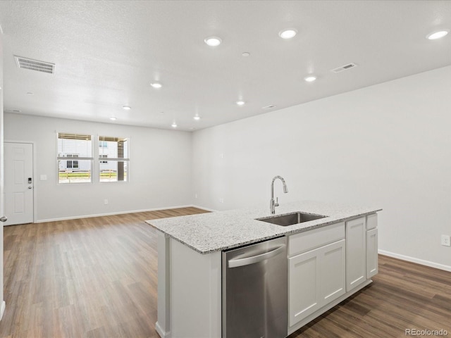 1618 Riverplace Dr Unit 2, Windsor, CO 80550 - kitchen featuring dishwasher, a sink, wood finished floors, light stone counters, and a kitchen island with sink