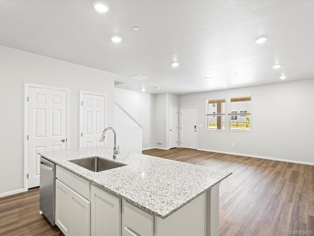 1618 Riverplace Dr Unit 2, Windsor, CO 80550 - kitchen featuring a sink, stainless steel dishwasher, dark wood-style floors, a center island with sink, and recessed lighting