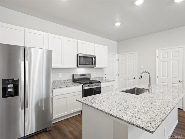 1618 Riverplace Dr Unit 2, Windsor, CO 80550 - kitchen featuring appliances with stainless steel finishes, a sink, white cabinets, dark wood finished floors, and recessed lighting