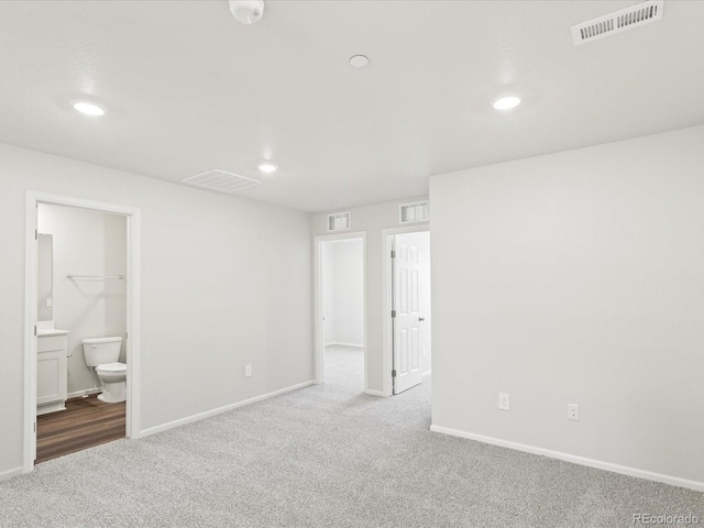 1618 Riverplace Dr Unit 2, Windsor, CO 80550 - unfurnished bedroom featuring carpet, recessed lighting, baseboards, and connected bathroom