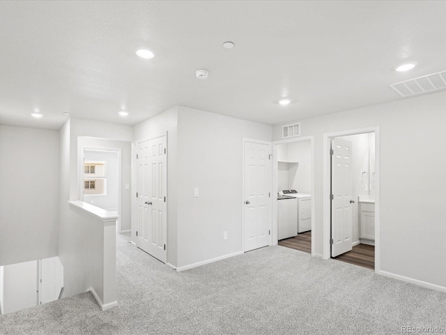 1618 Riverplace Dr Unit 2, Windsor, CO 80550 - empty room with carpet, washing machine and dryer, recessed lighting, baseboards, and a smoke detector