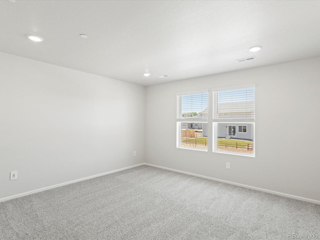 1618 Riverplace Dr Unit 2, Windsor, CO 80550 - unfurnished room with carpet flooring, baseboards, and recessed lighting
