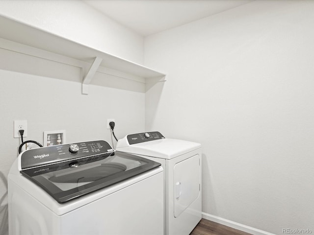 1618 Riverplace Dr Unit 2, Windsor, CO 80550 - washroom with washing machine and clothes dryer, dark wood-style flooring, and baseboards