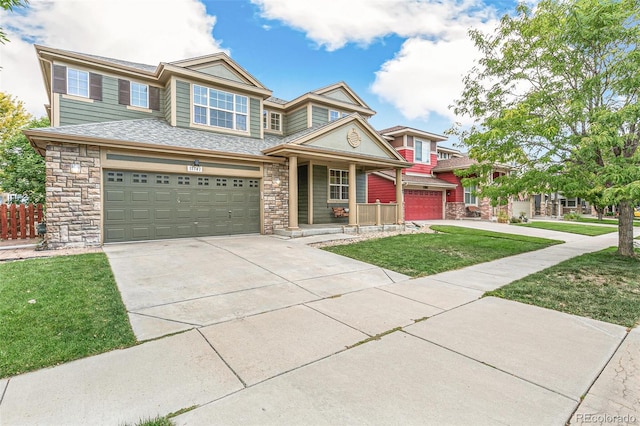 view of front of home with a garage and a front lawn