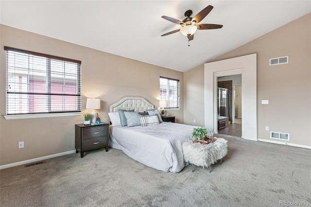 carpeted bedroom featuring vaulted ceiling and ceiling fan