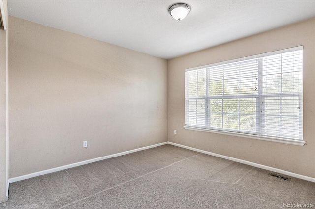 view of carpeted spare room