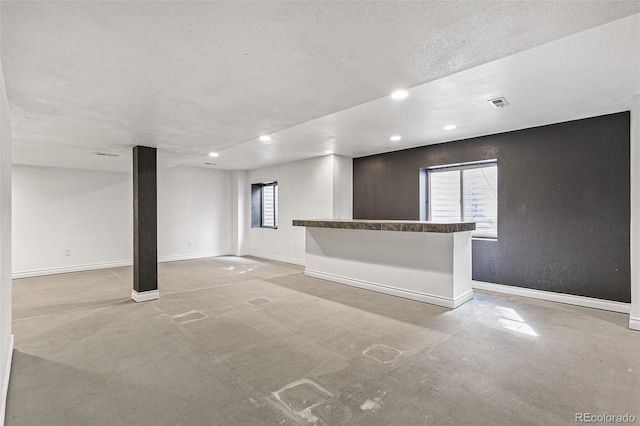 basement with a textured ceiling