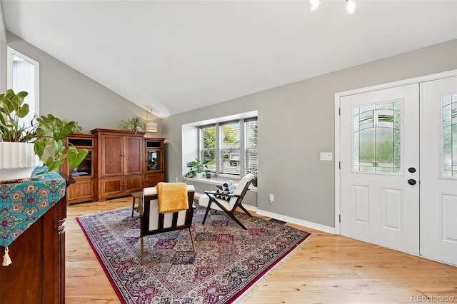 6248 E Mineral Pl, Centennial, CO 80112 - dining area featuring vaulted ceiling and light wood finished floors