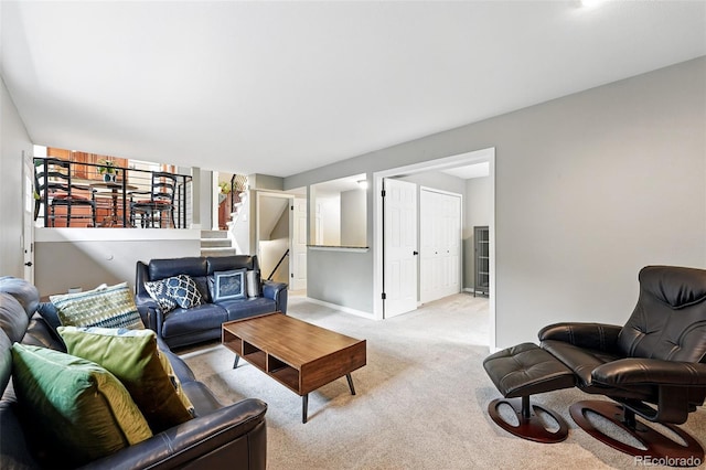 6248 E Mineral Pl, Centennial, CO 80112 - living room featuring light colored carpet, stairs, and baseboards