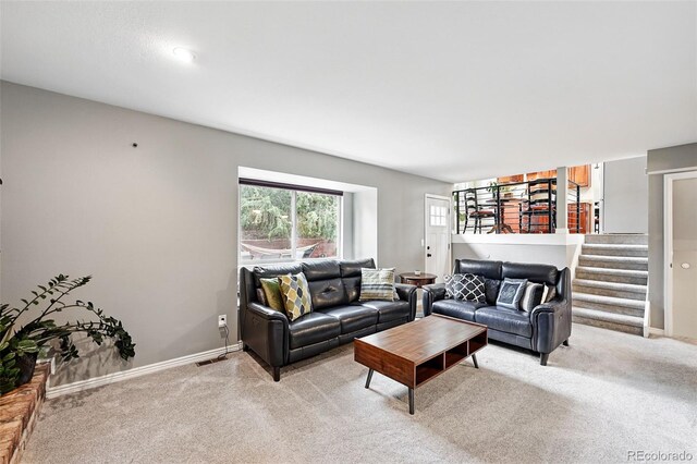 6248 E Mineral Pl, Centennial, CO 80112 - living area featuring light colored carpet, stairs, and baseboards