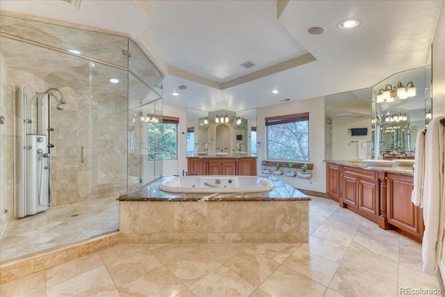 16713 W Archer Ave, Golden, CO 80401 - bathroom featuring healthy amount of natural light, a stall shower, a garden tub, and two vanities