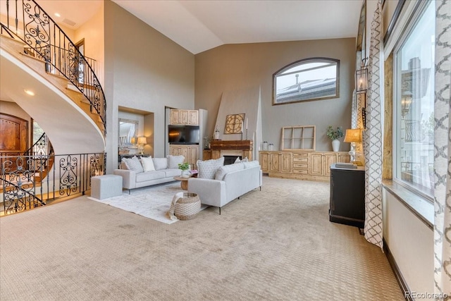16713 W Archer Ave, Golden, CO 80401 - living area featuring carpet flooring, high vaulted ceiling, and stairs
