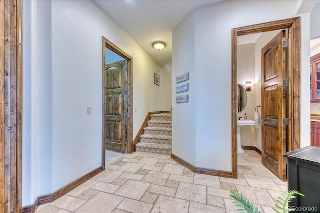 16713 W Archer Ave, Golden, CO 80401 - hall featuring baseboards, stone tile flooring, and stairway
